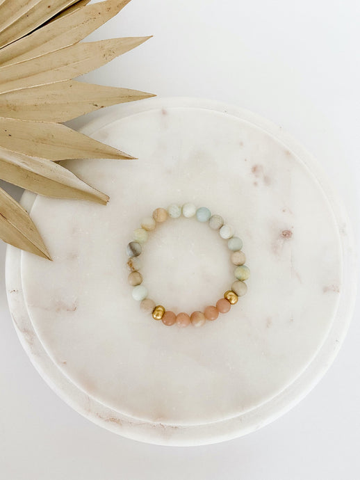 Beaded mala bracelet with amazonite and sunstone gemstones.
