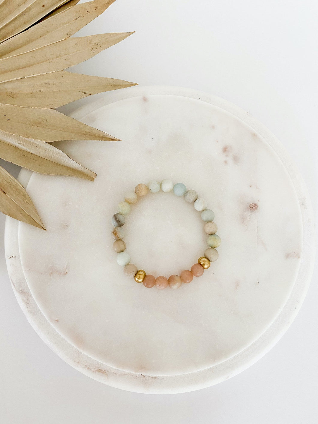 Beaded mala bracelet with amazonite and sunstone gemstones.